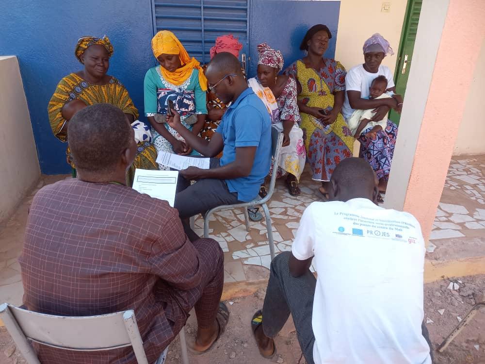 Health worker using digital health platform in the field