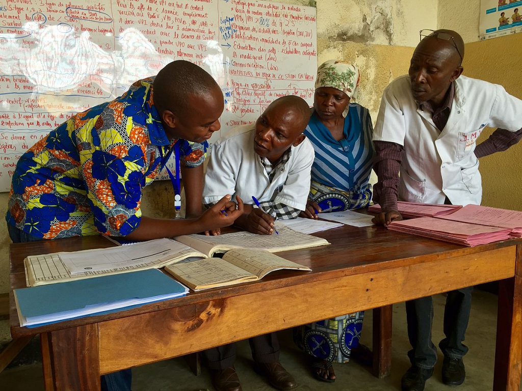 Health worker discussing directly