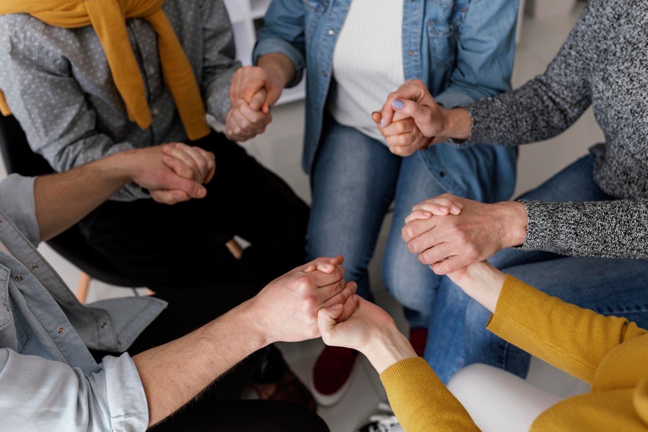 a group of people hand in hand