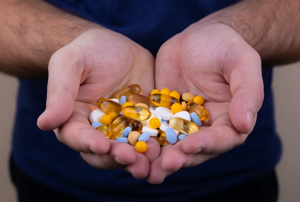 Person holding medicine representing equitable access to medicine