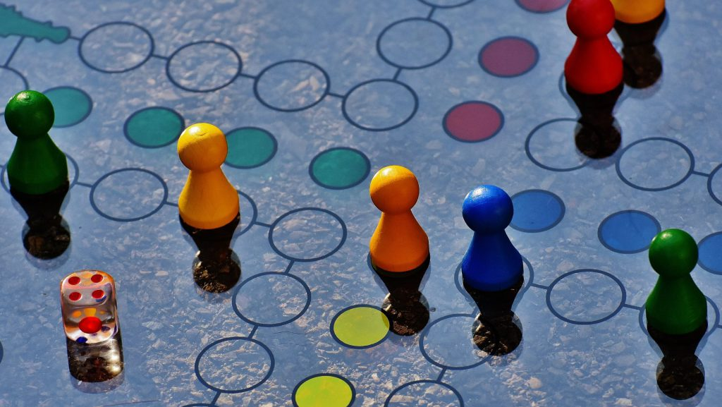 A board game showcasing vibrant, multicolored pieces arranged on the playing surface.